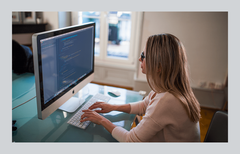 woman sitting on a desk